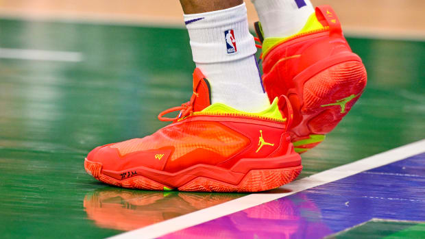View of red and yellow Jordan shoes.